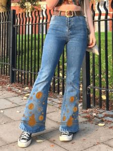 Flared jeans with floral embroidery sold by Streetwear Society