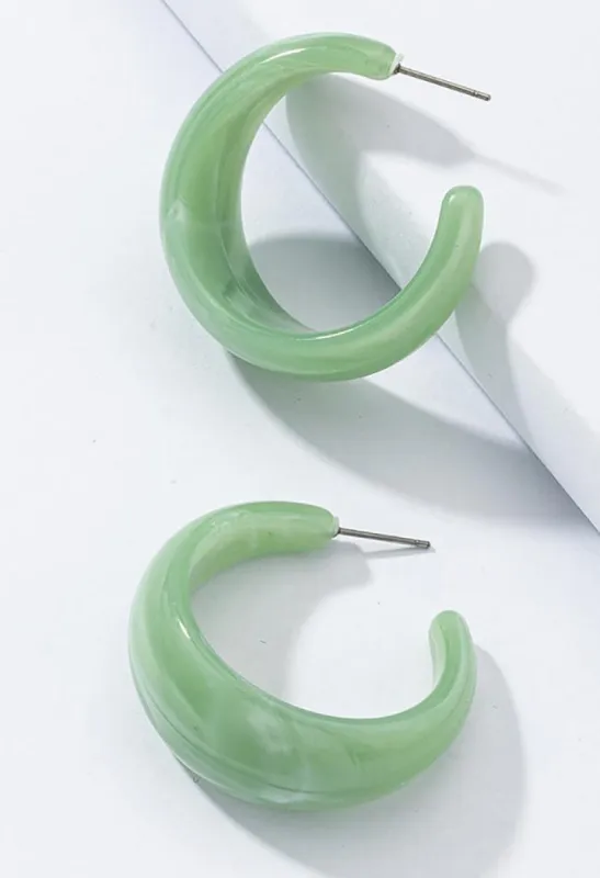 C-shaped acrylic earrings sold by Streetwear Society