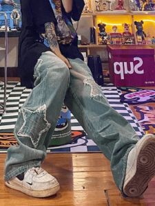 Faded blue star patch boyfriend jeans sold by Streetwear Society