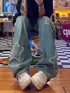 Faded blue star patch boyfriend jeans sold by Streetwear Society