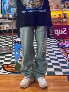 Faded blue star patch boyfriend jeans sold by Streetwear Society