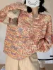 Rainbow front button cardigan sold by Streetwear Society