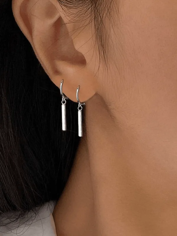 Silver geometric dangling earrings sold by Streetwear Society