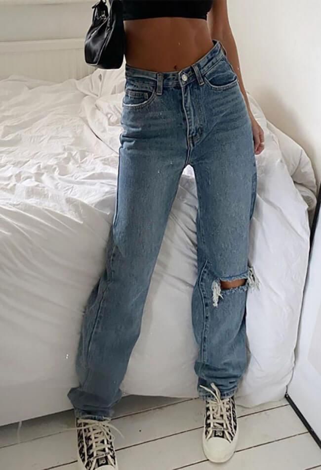 Vintage ripped boyfriend jeans sold by Streetwear Society