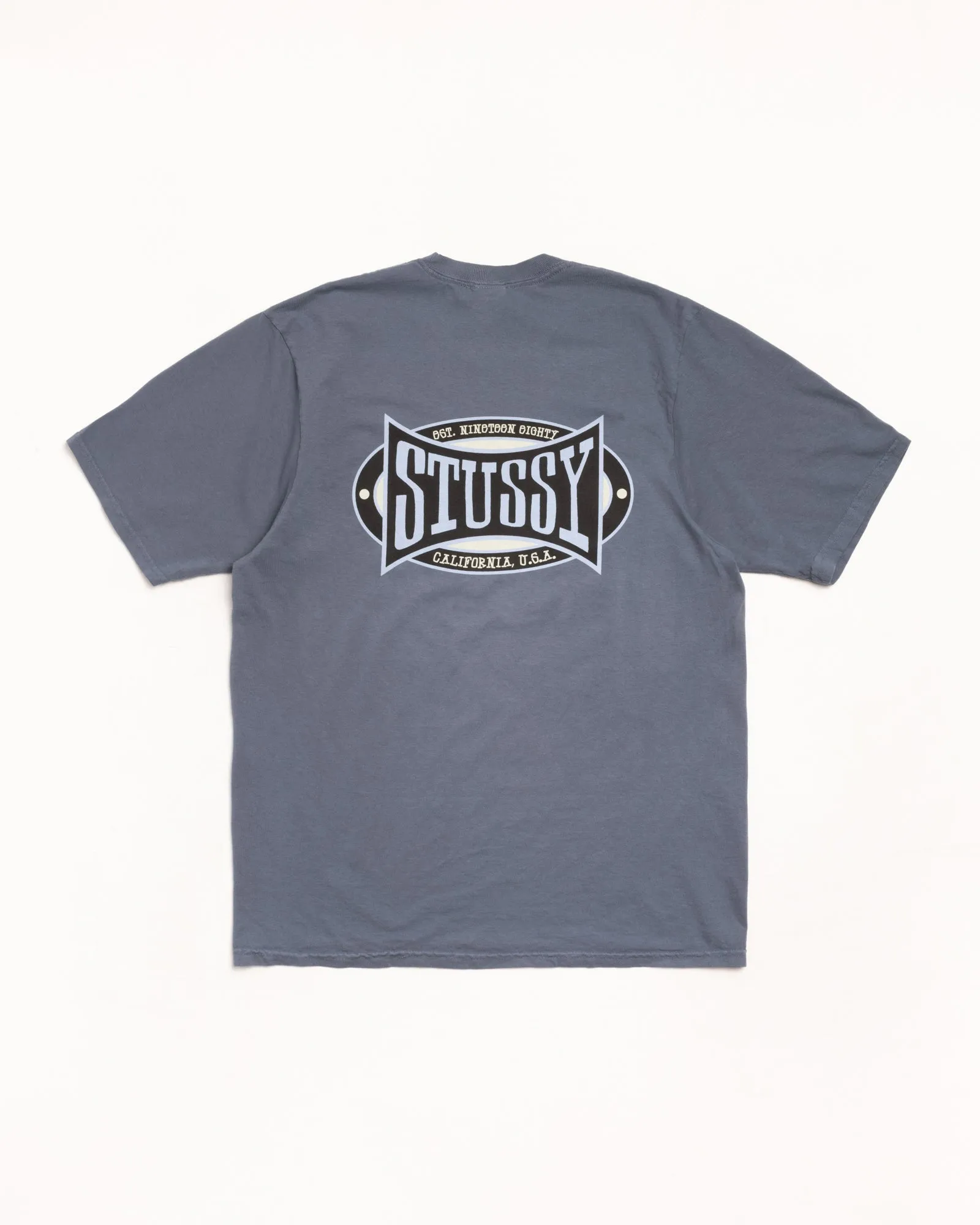 CHAMPION OVAL TEE PIGMENT DYED sold by Stussy