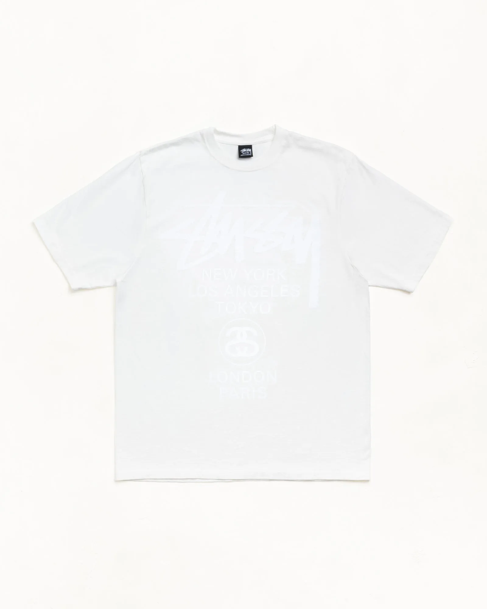 WORLD TOUR TEE PIGMENT DYED sold by Stussy