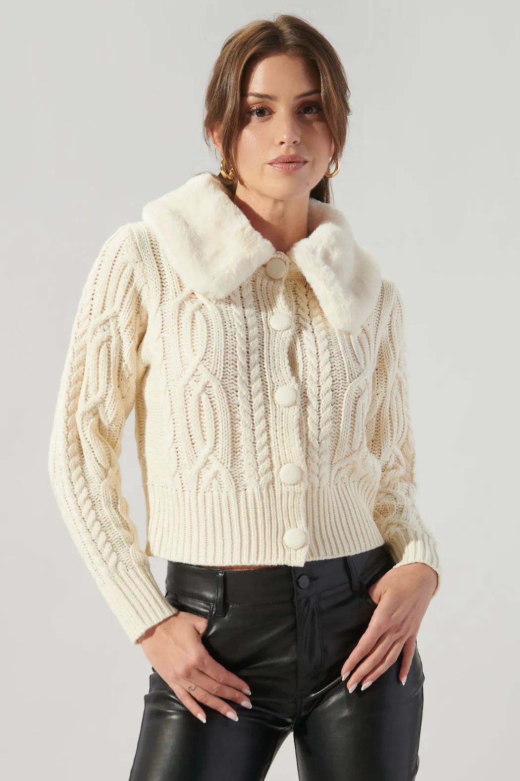 In a Flurry Cable Knit Fur Collar Cardigan sold by Sugarlips