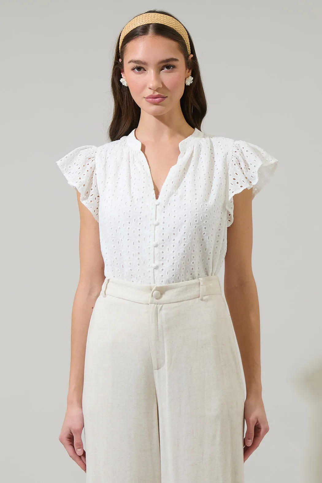 Moe Eyelet Split Neck Top sold by Sugarlips