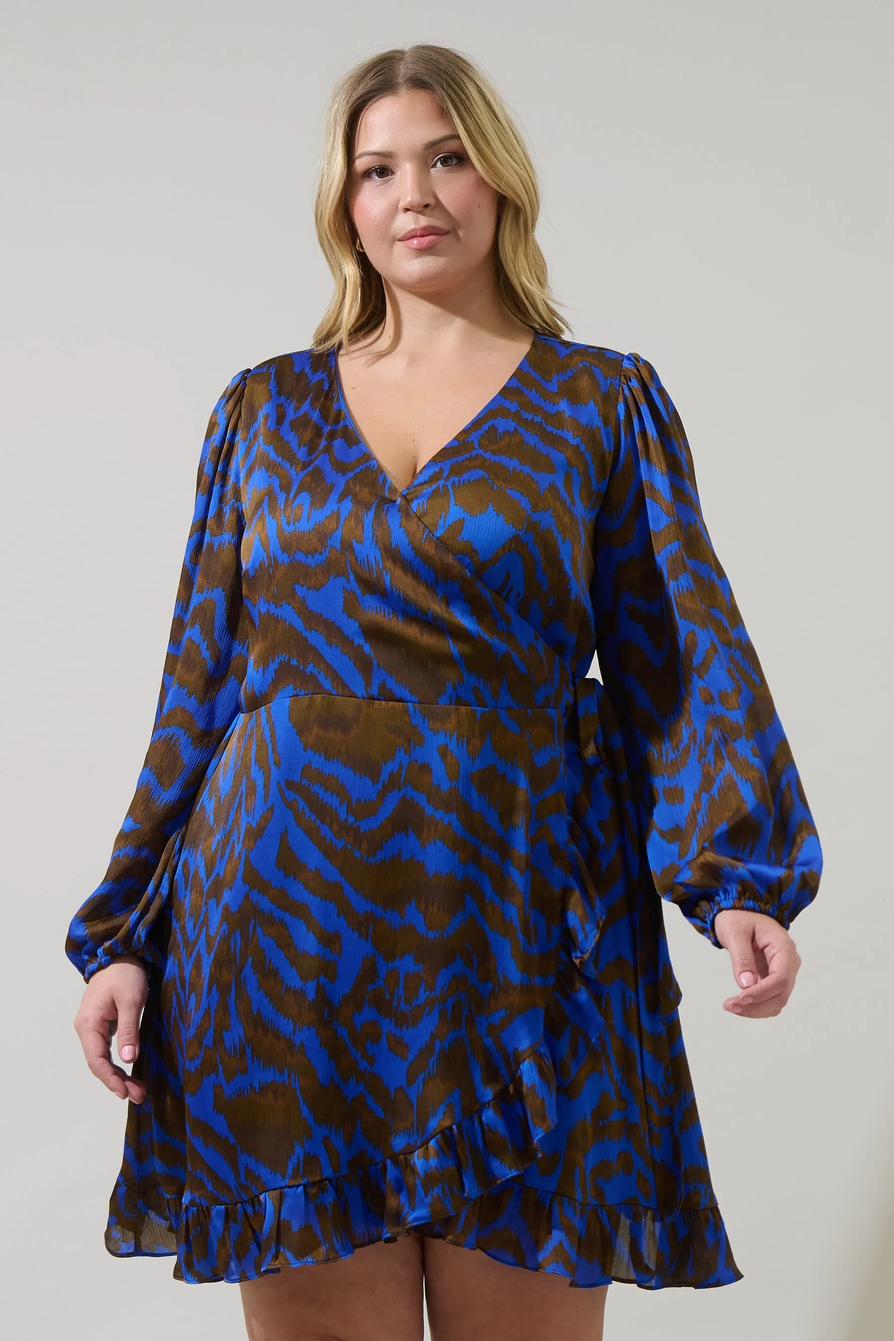 Krista Abstract Mini Wrap Dress Curve sold by Sugarlips