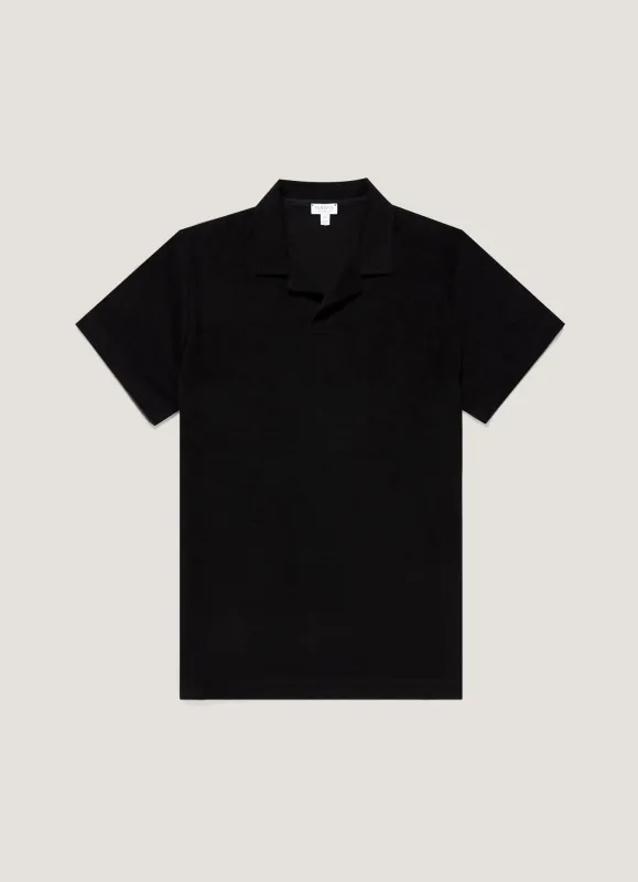 Men's Towelling Polo Shirt in Black made by Sunspel