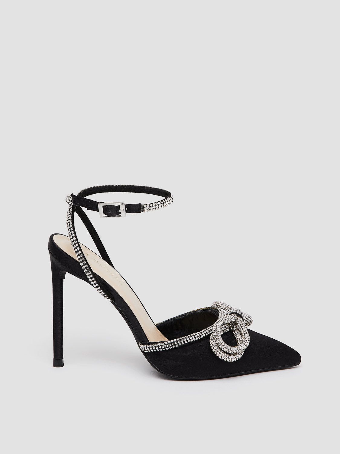 Pointed Toe High Heel Pump With Rhinestone Bow Embellishment sold by Suzy Shier