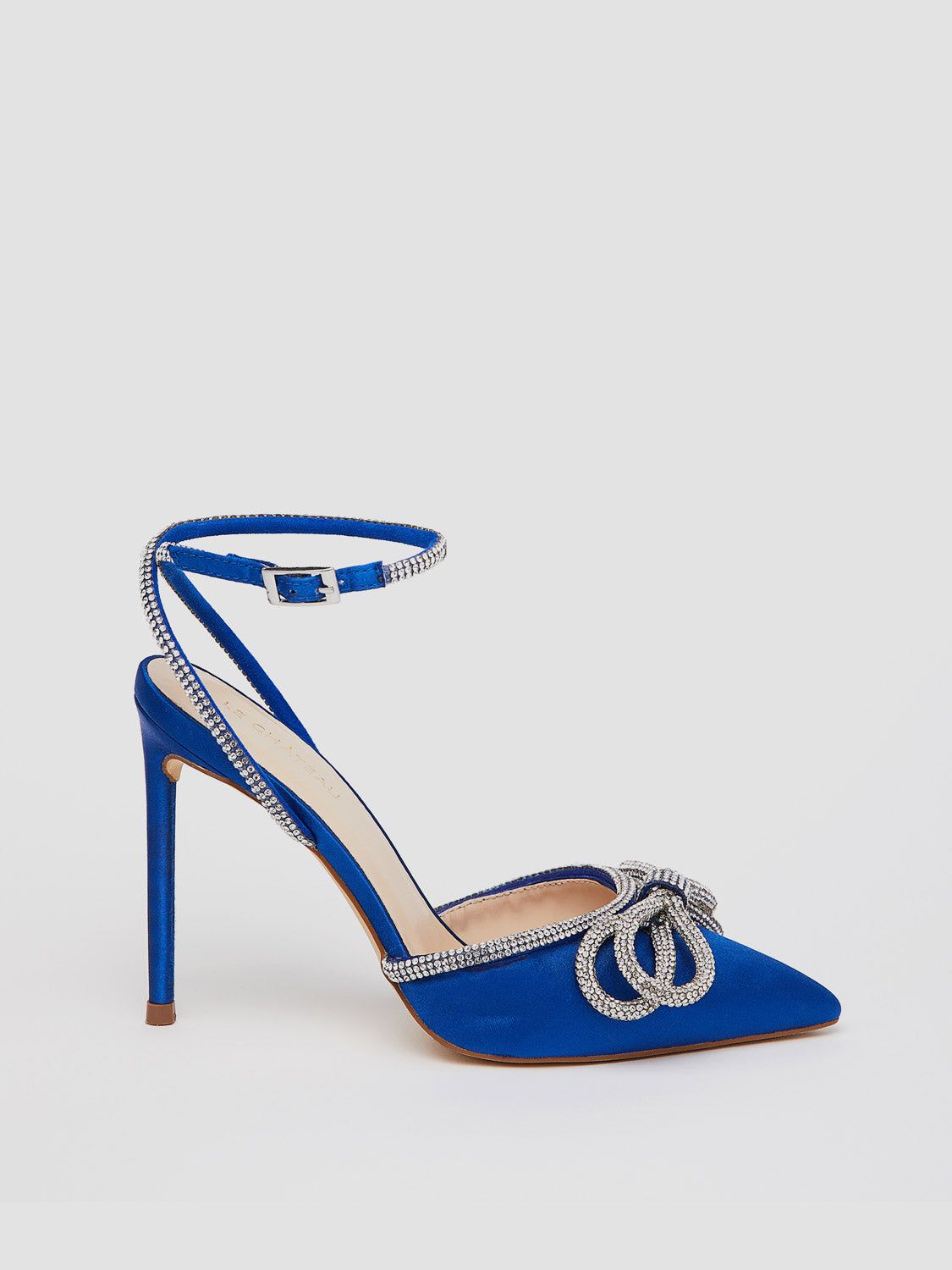Pointed Toe High Heel Pump With Rhinestone Bow Embellishment sold by Suzy Shier