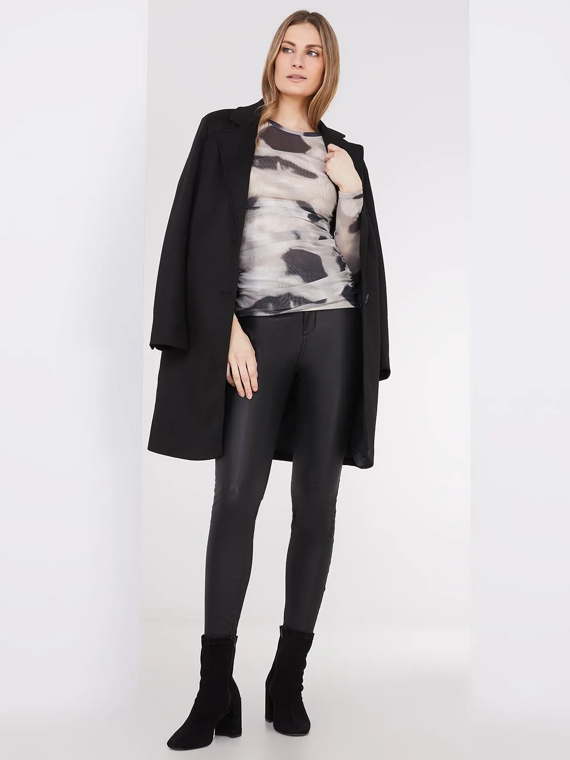 Coated Skinny-Leg Jeans With Zipper Details sold by Suzy Shier