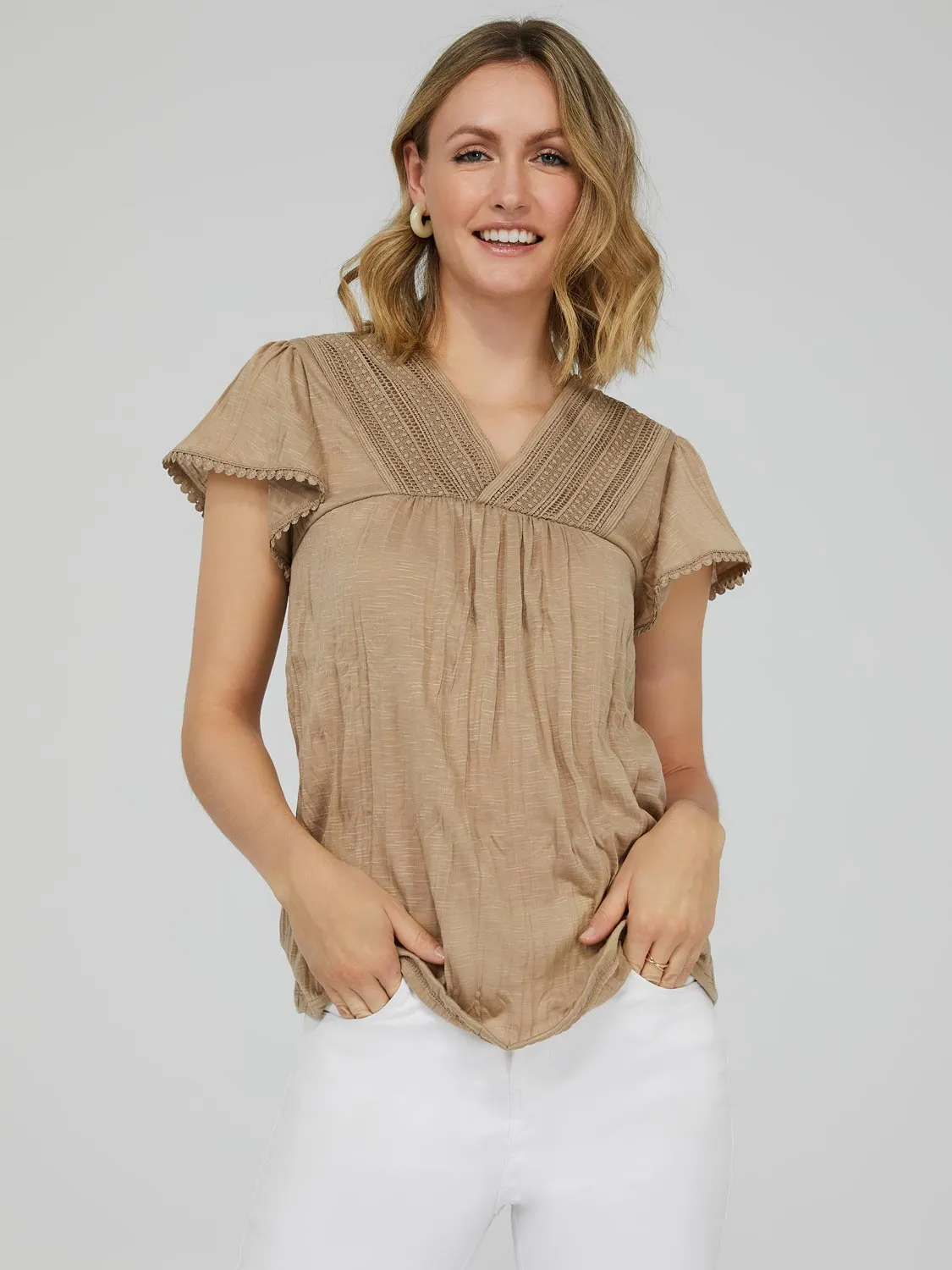 Short Sleeve V-Neck Top With Crochet Detail sold by Suzy Shier