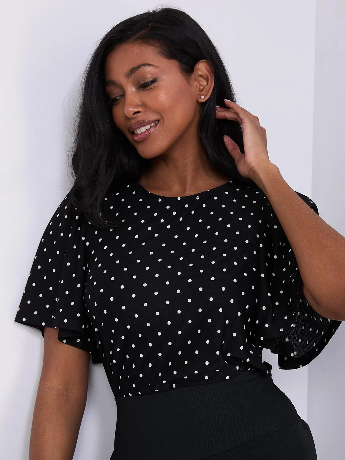 Polka Dot Flutter Sleeve Top sold by Suzy Shier