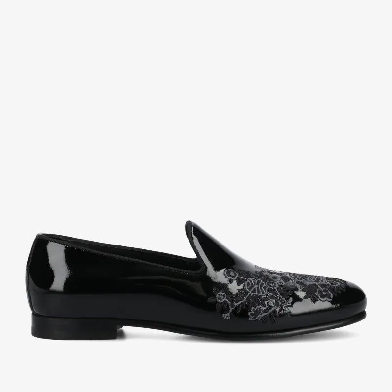 The Estate Slipper in Black Patent Leather sold by Taft