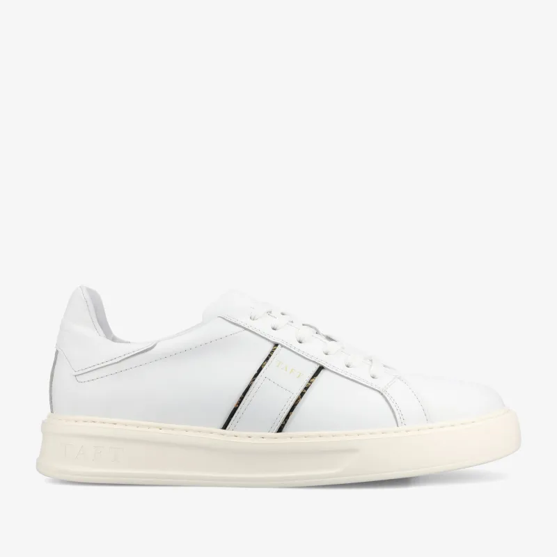 The Logan Sneaker in White sold by Taft