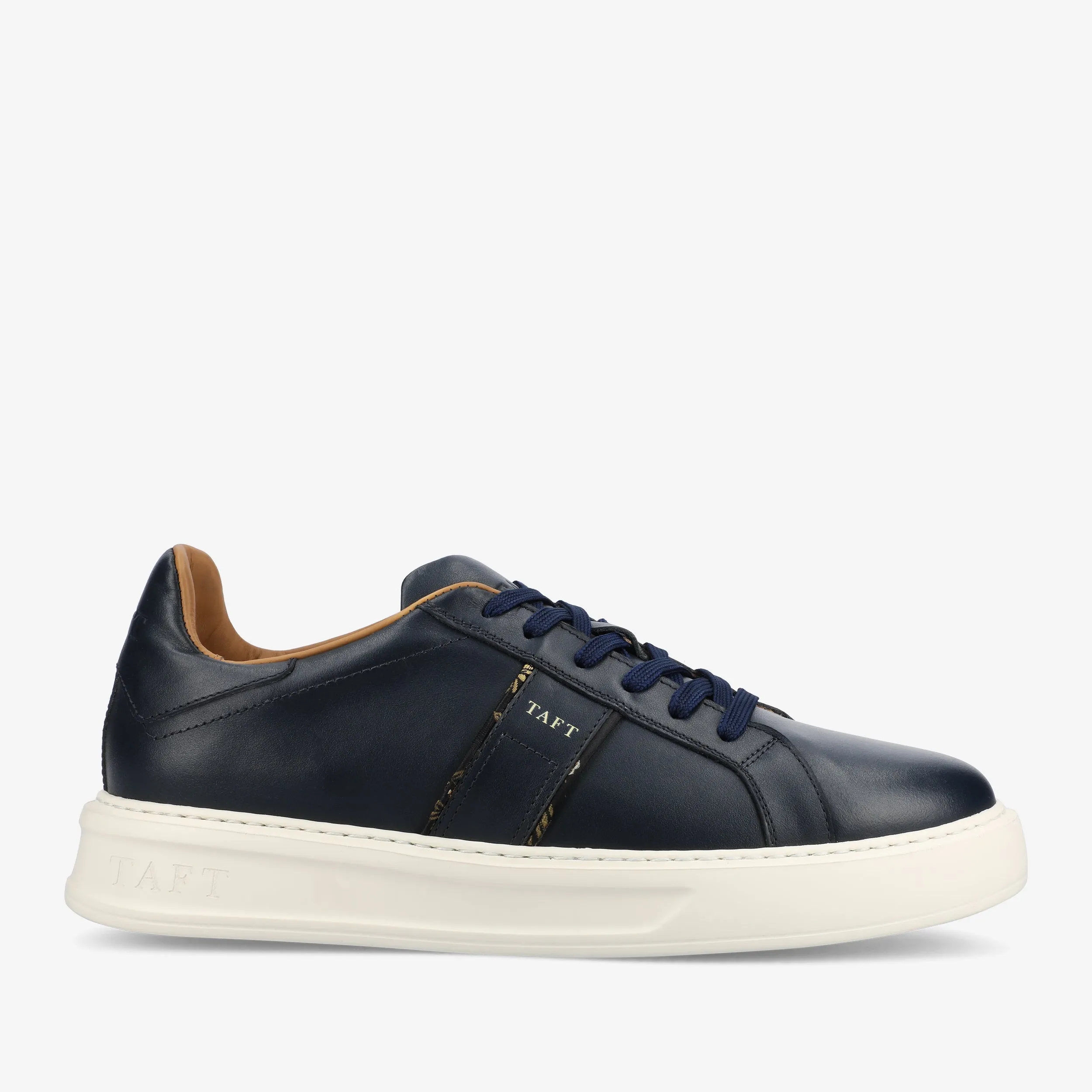 The Logan Sneaker in Navy sold by Taft