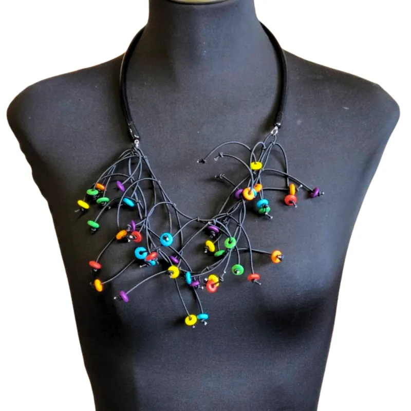 Wooden Kinetic Necklace and Earrings sold by Takara