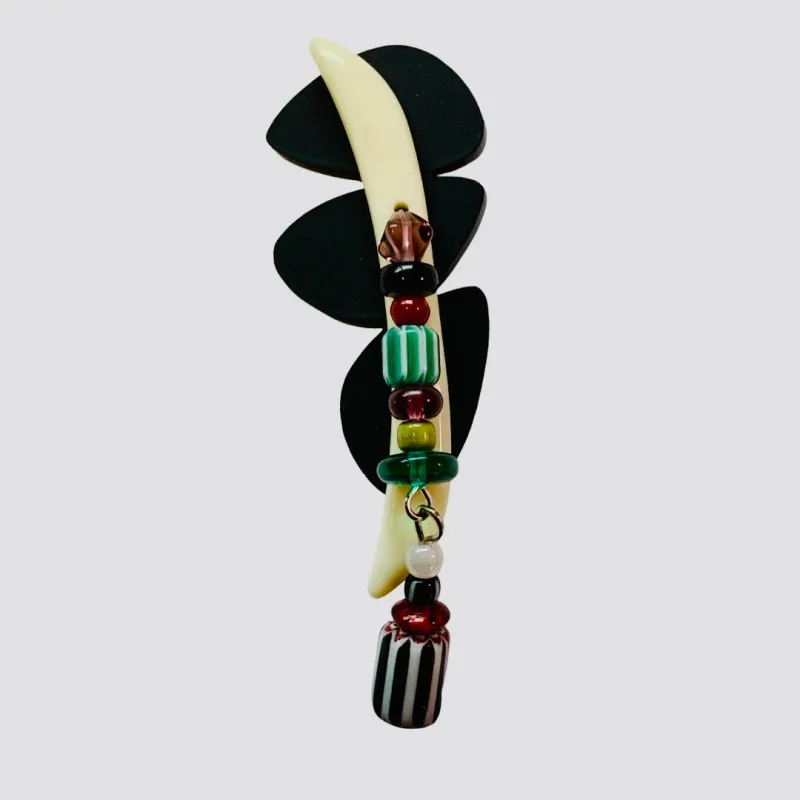 Goddess with Machete Earring sold by Takara