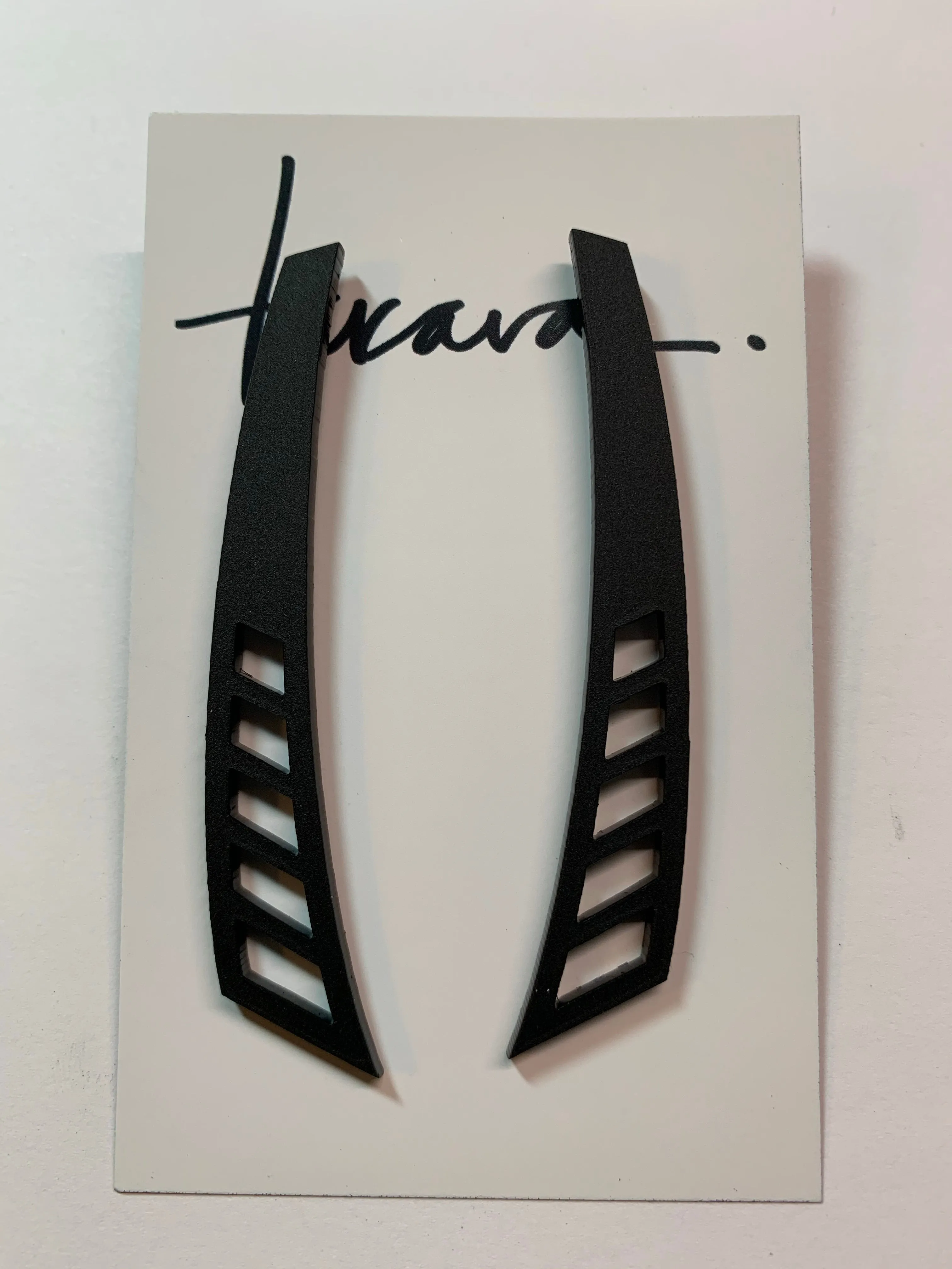 Cutout Fins Earrings sold by Takara