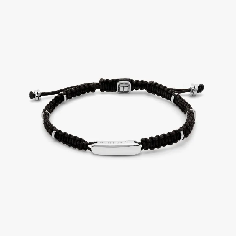 Black macrame bracelet with silver baton sold by Tateossian