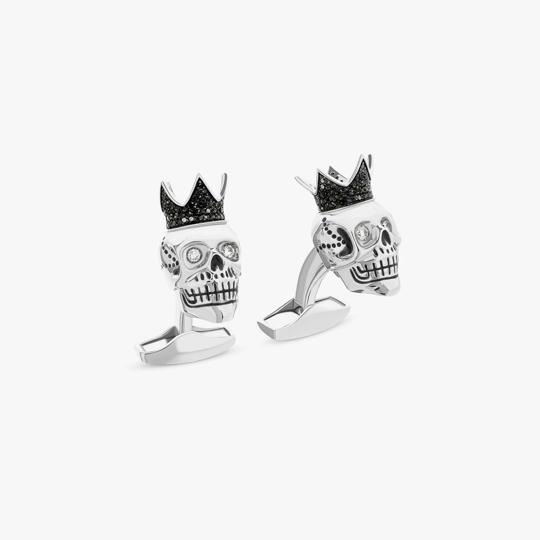 Black diamond king skull cufflinks with white diamonds in sterling silver sold by Tateossian