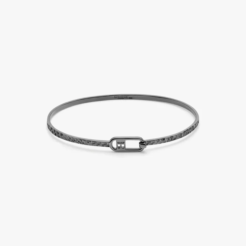 T-bangle in hammered black rhodium plated sterling silver made by Tateossian