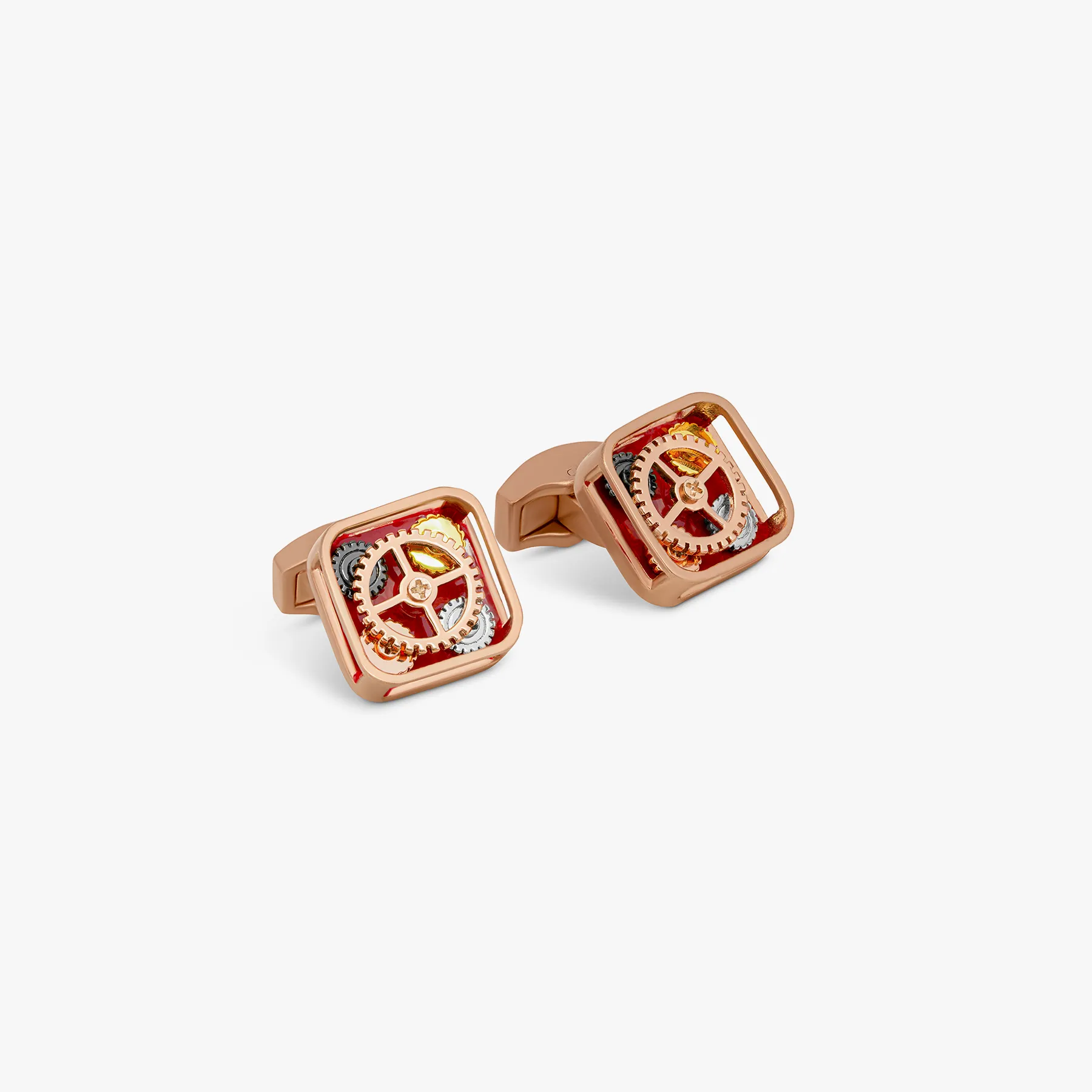 Pop Gears cufflinks with red enamel in gunmetal sold by Tateossian