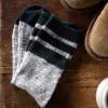 The Camp Sock in Heather Grey sold by Taylor Stitch