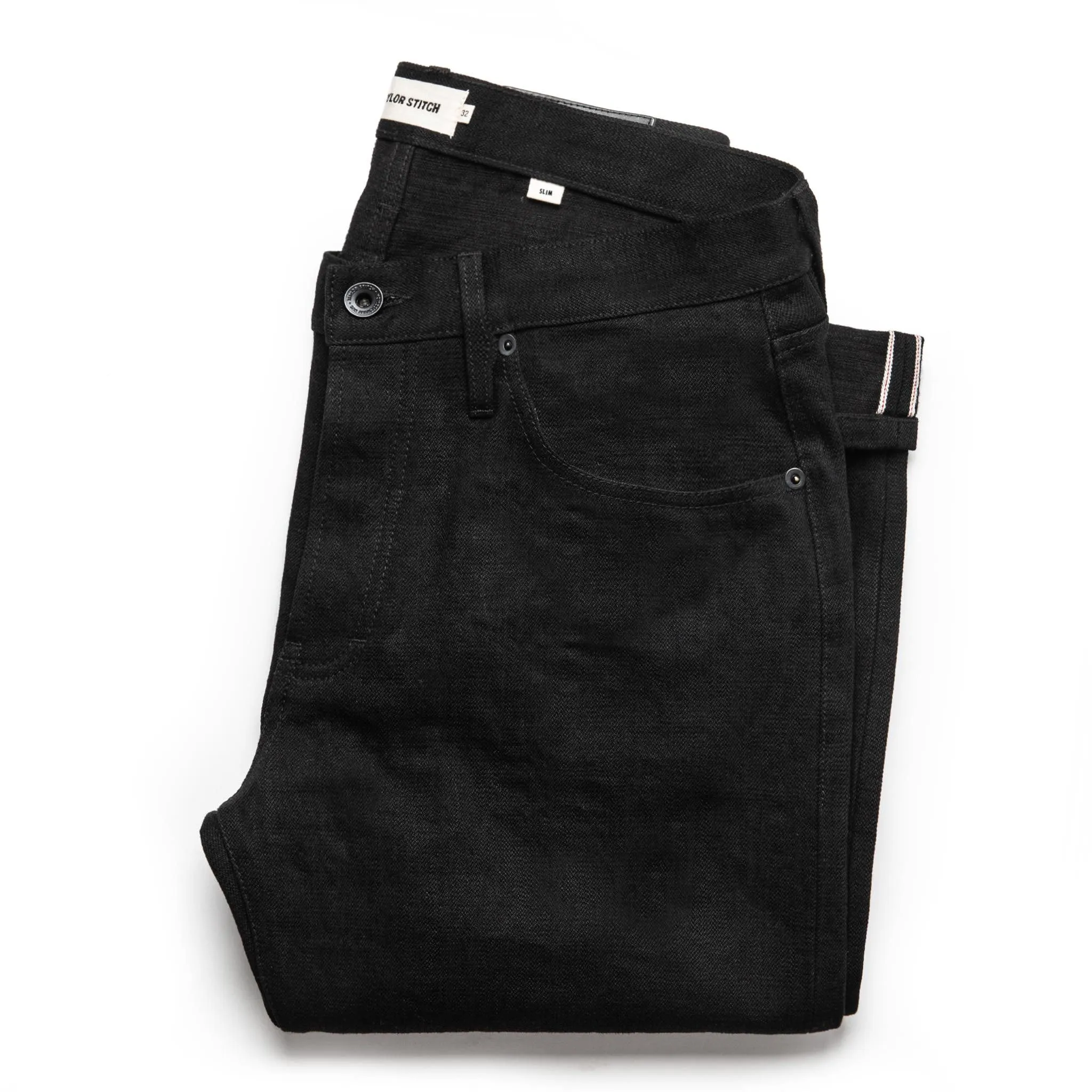 The Slim Jean in Black Selvage sold by Taylor Stitch