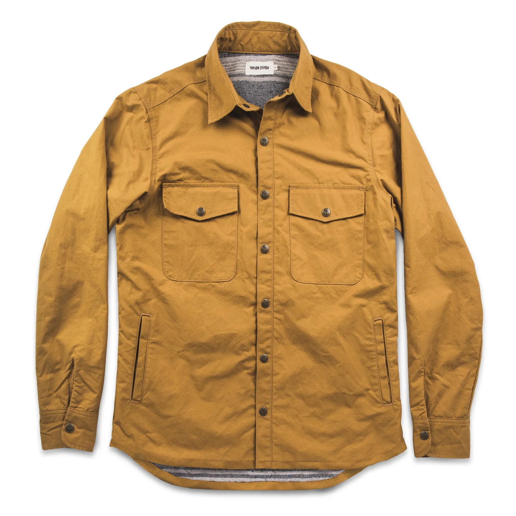 The Chore Jacket in Mustard Dry Wax Canvas sold by Taylor Stitch