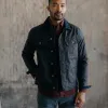 The Long Haul Jacket in Coal Waxed Canvas sold by Taylor Stitch
