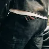 The Democratic Jean in Black Over-dye Selvage sold by Taylor Stitch