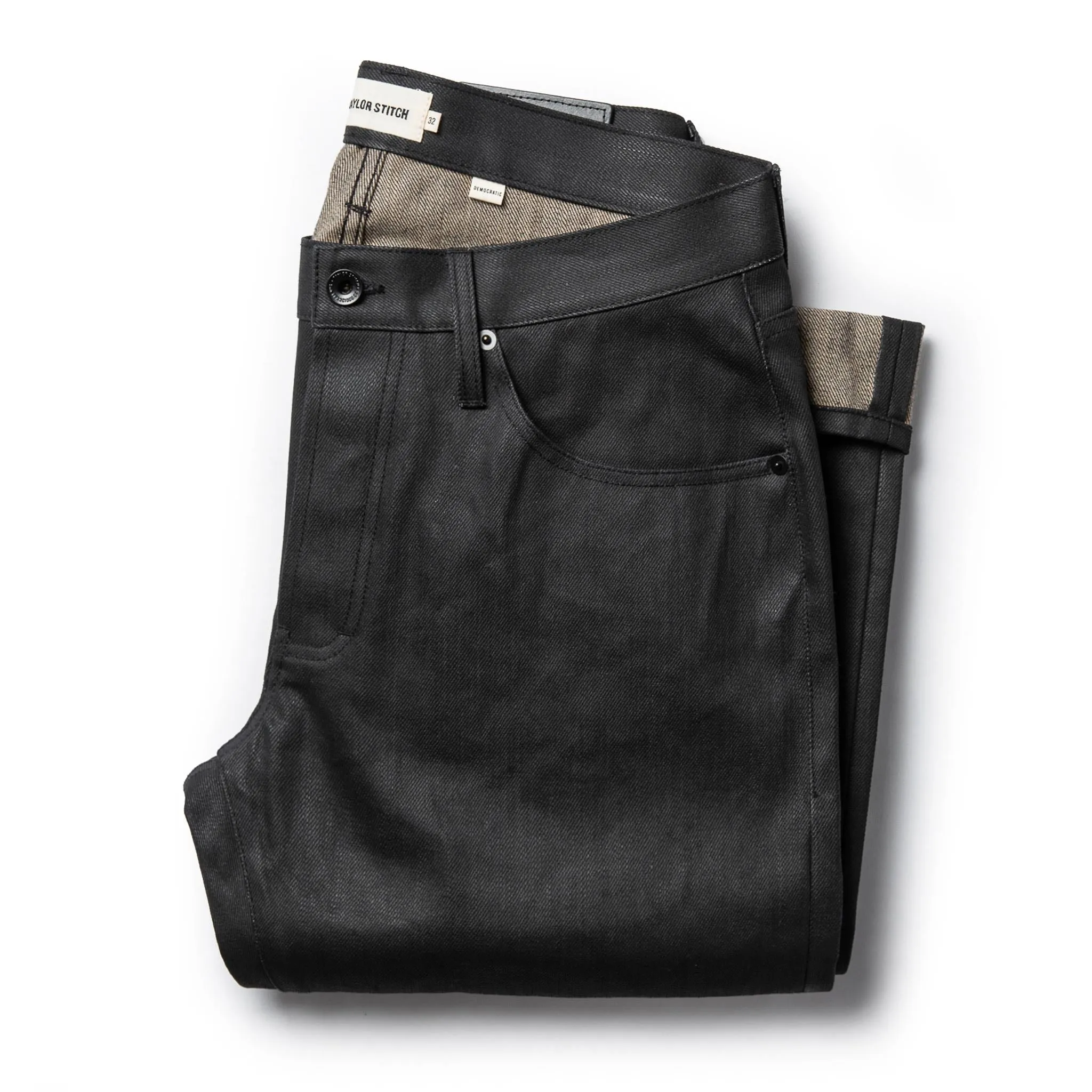 The Democratic Jean in Black Over-dye Selvage sold by Taylor Stitch