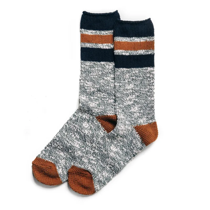 The Camp Sock in Heather Olive sold by Taylor Stitch