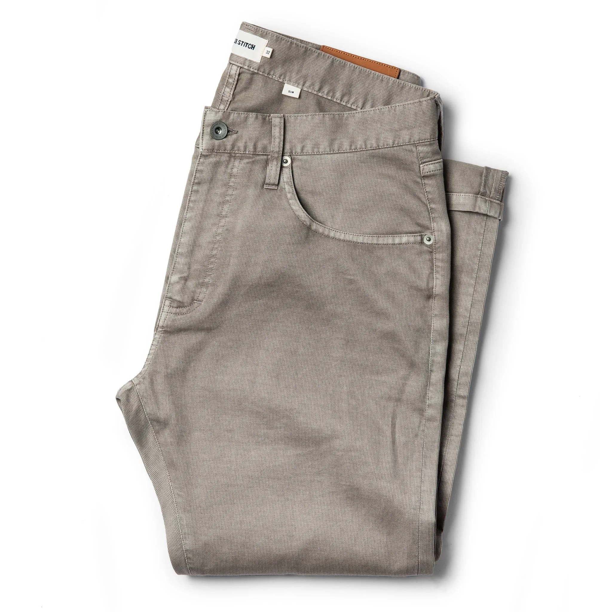 The Slim All Day Pant in Aluminum Bedford Cord sold by Taylor Stitch