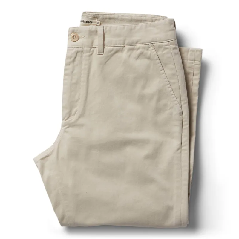 The Slim Foundation Pant in Organic Stone sold by Taylor Stitch