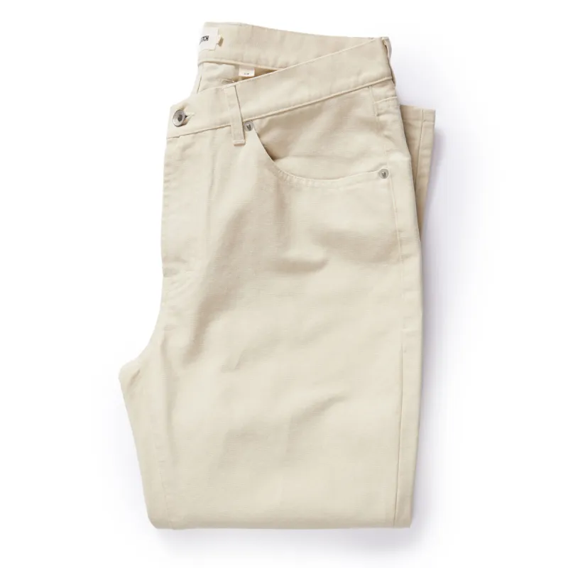 The Slim All Day Pant in Dune Canvas sold by Taylor Stitch