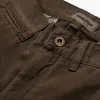 The Democratic Chino in Chocolate sold by Taylor Stitch