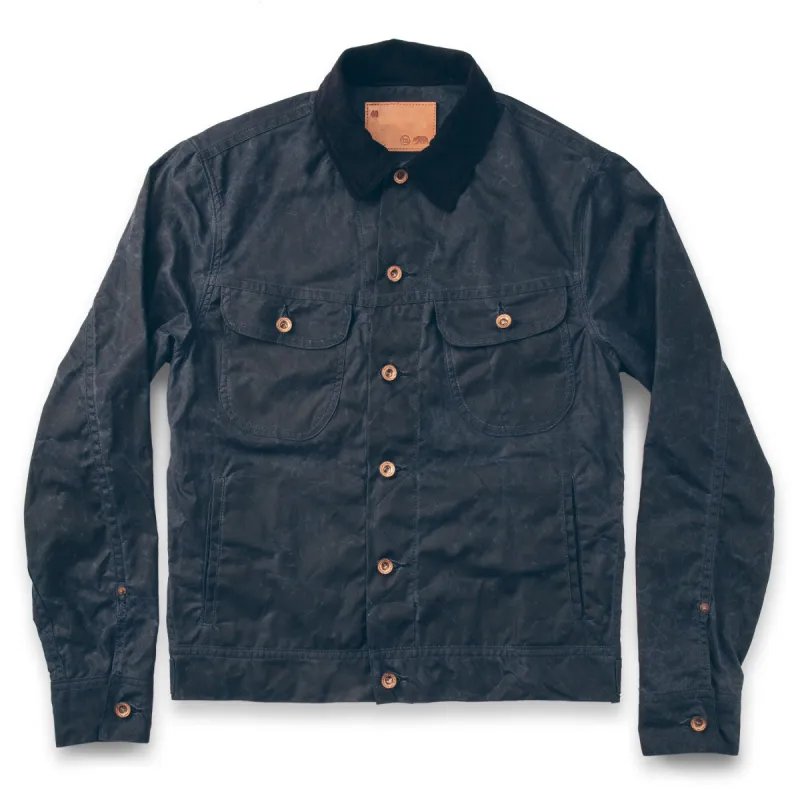 The Long Haul Jacket in Navy Waxed Canvas sold by Taylor Stitch