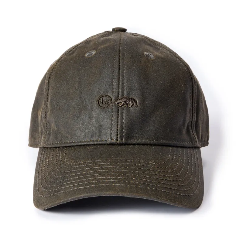 The Ball Cap in Soil Waxed Canvas sold by Taylor Stitch