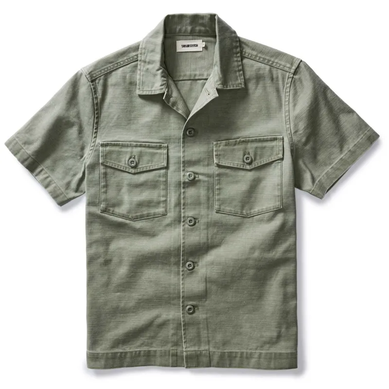 The Short Sleeve Surplus Shirt in Field Olive Reverse Sateen sold by Taylor Stitch