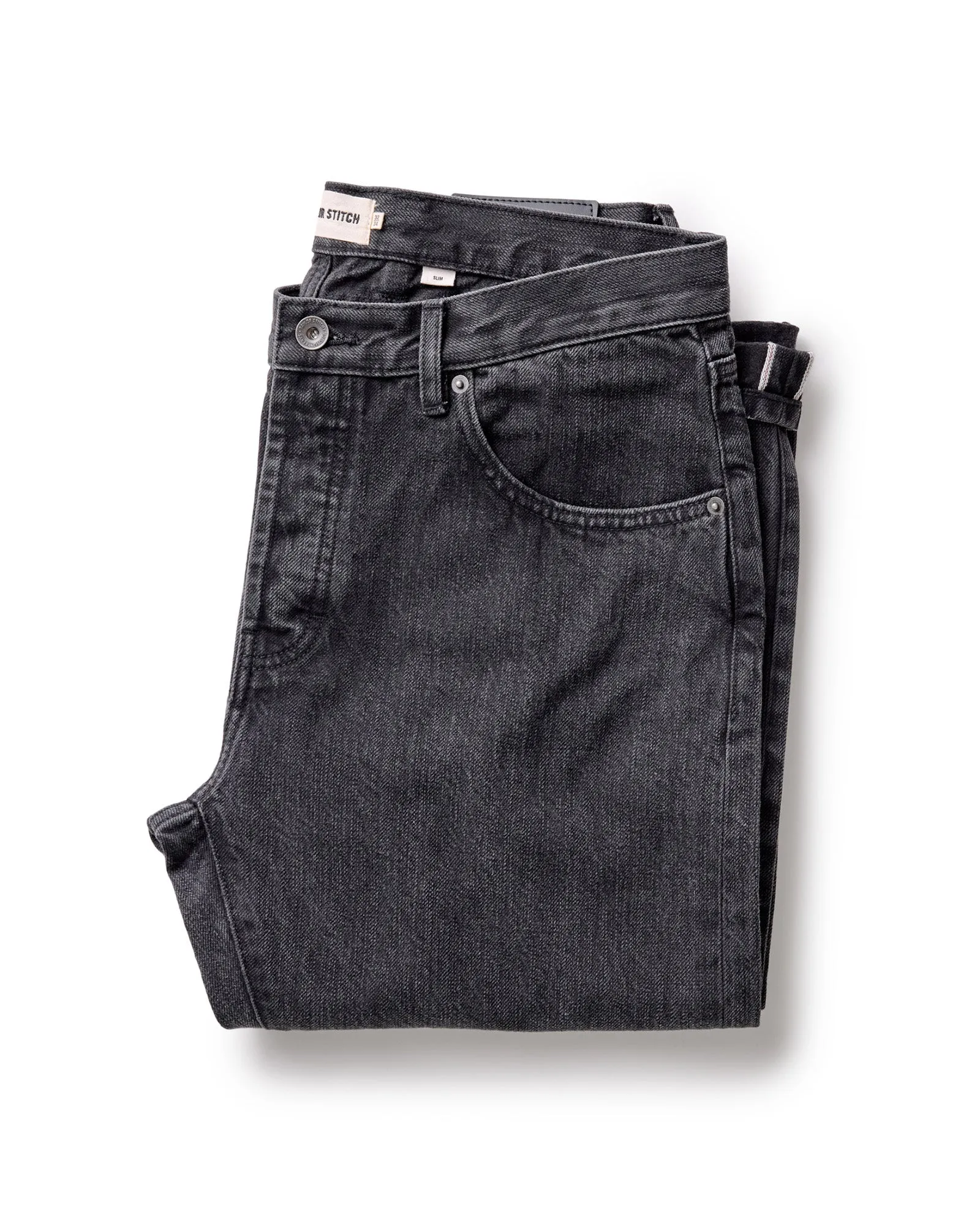 The Slim Jean in Washed Black Organic Slub Selvedge sold by Taylor Stitch
