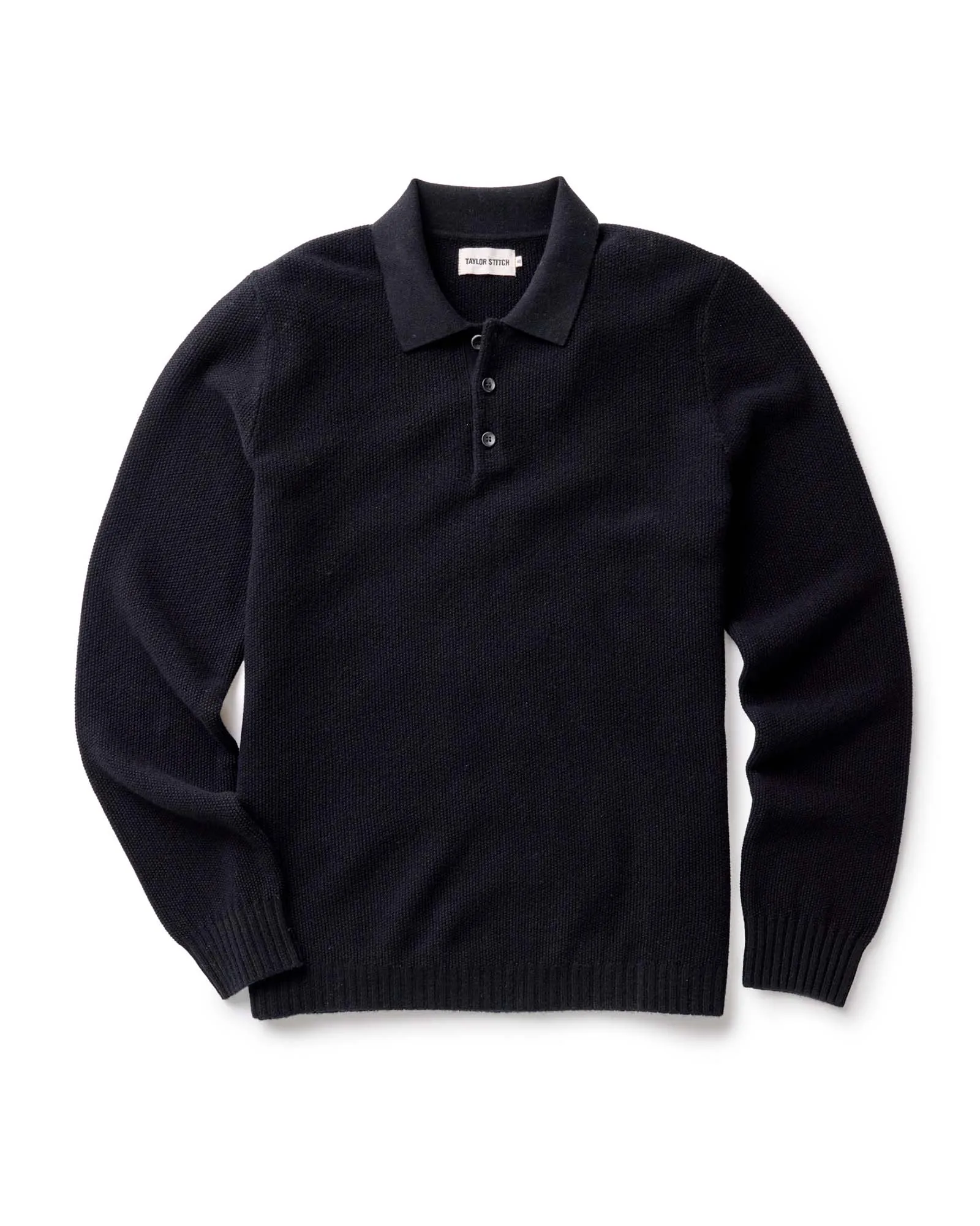 The Newton Sweater Polo in Midnight Merino sold by Taylor Stitch