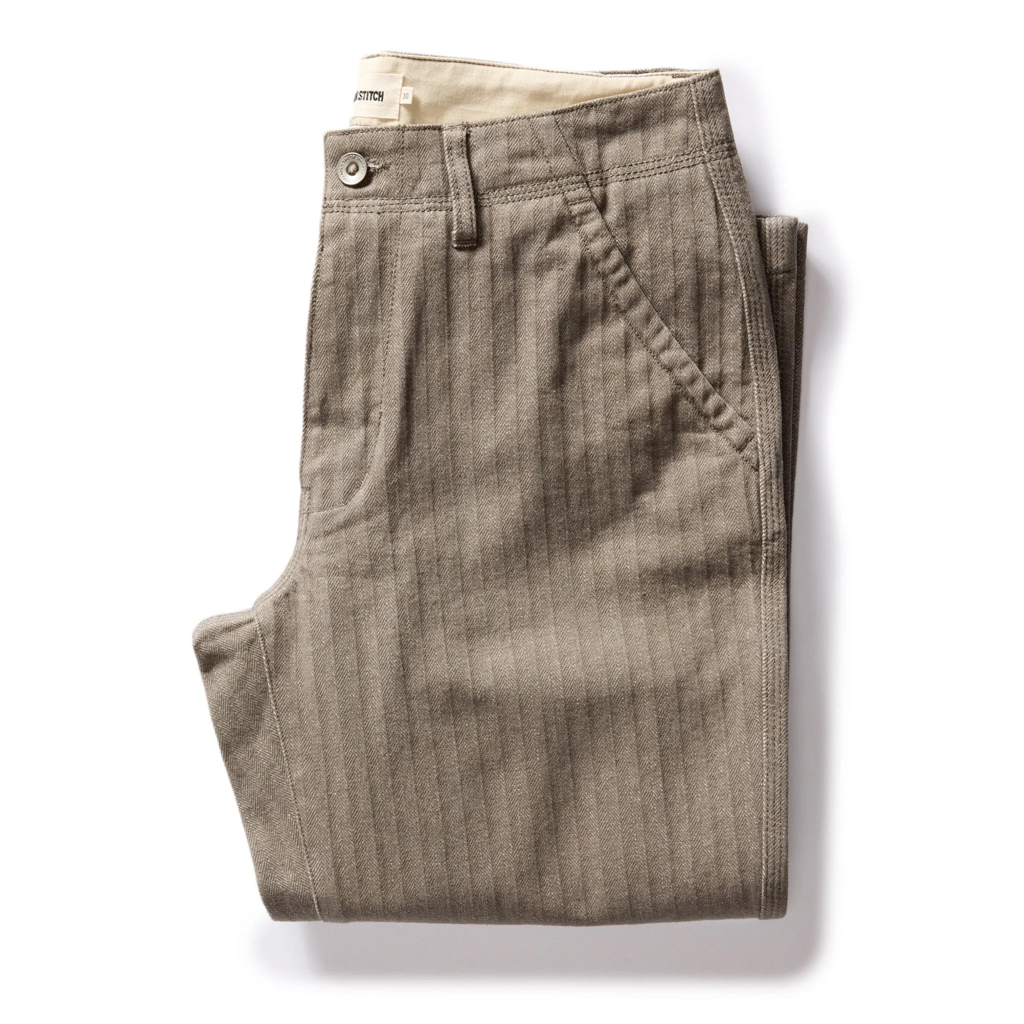 The Morse Pant in Smoked Olive Herringbone Twill sold by Taylor Stitch