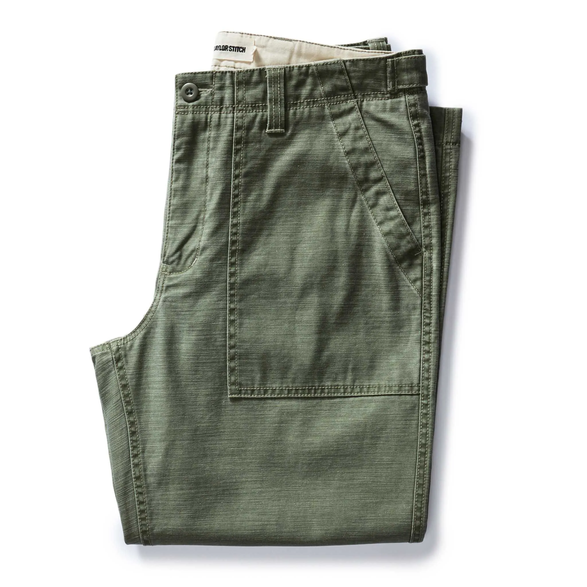 The Surplus Pant in Field Olive Reverse Sateen sold by Taylor Stitch