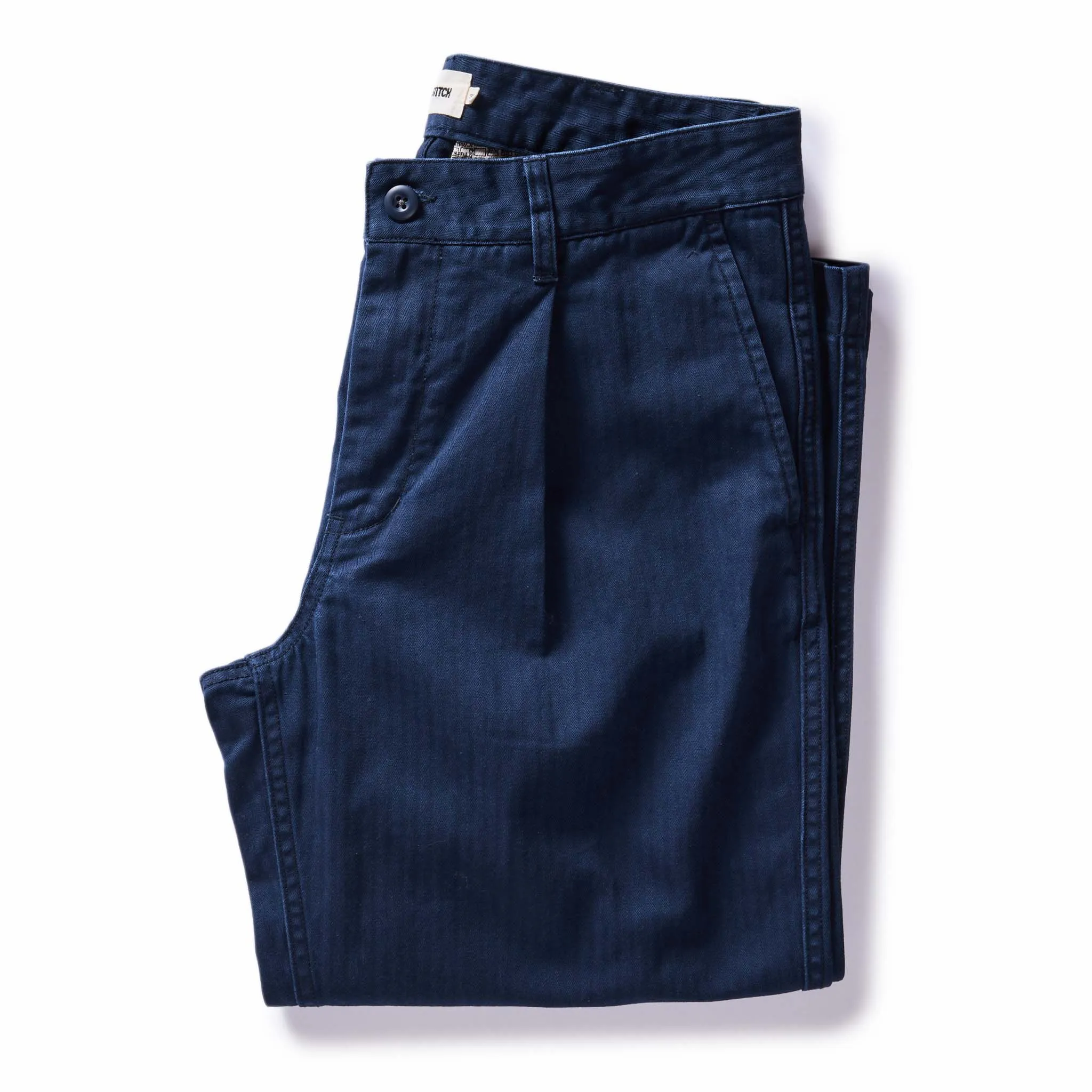 The Matlow Pant in Dark Navy Herringbone sold by Taylor Stitch