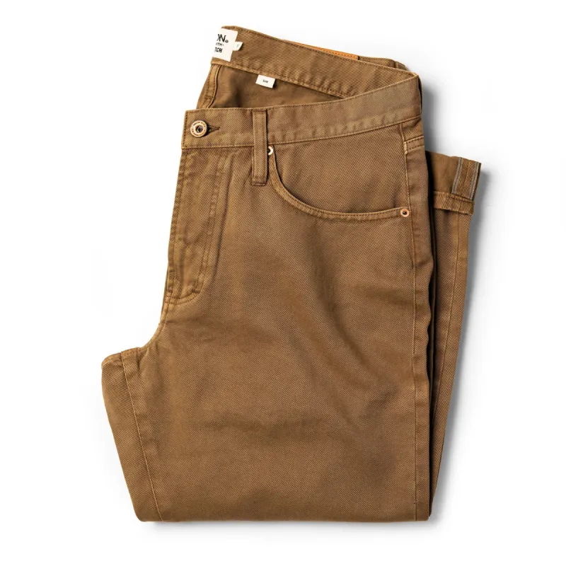 The Slim All Day Pant in Rustic Oak Organic Selvage sold by Taylor Stitch