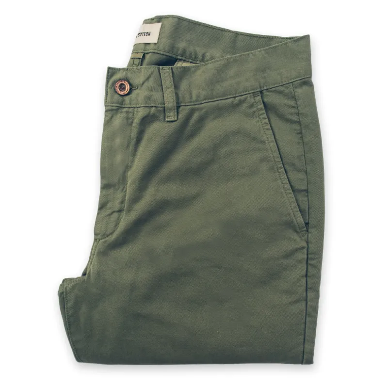 The Slim Chino in Army sold by Taylor Stitch